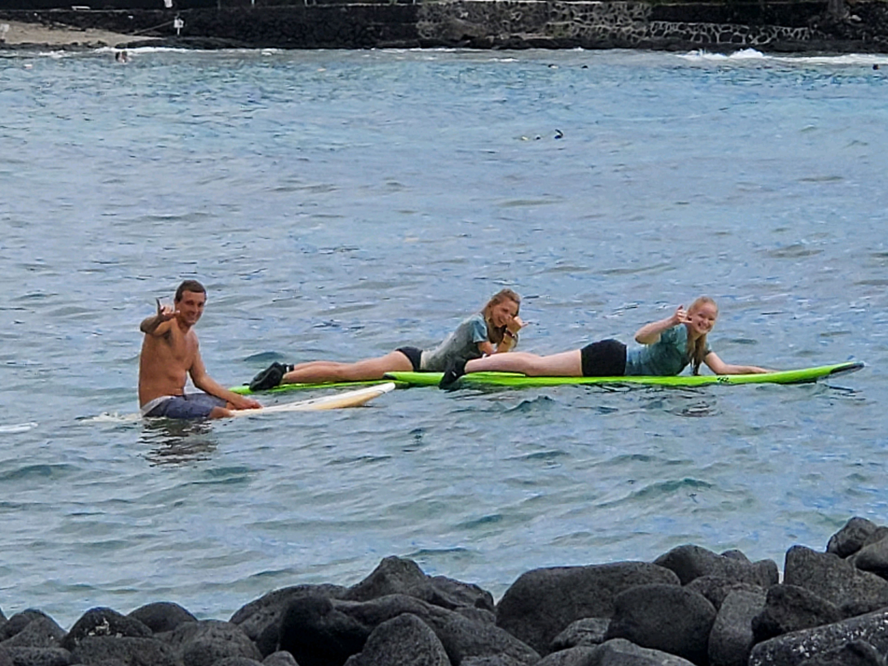 Surfers paddling out to surf