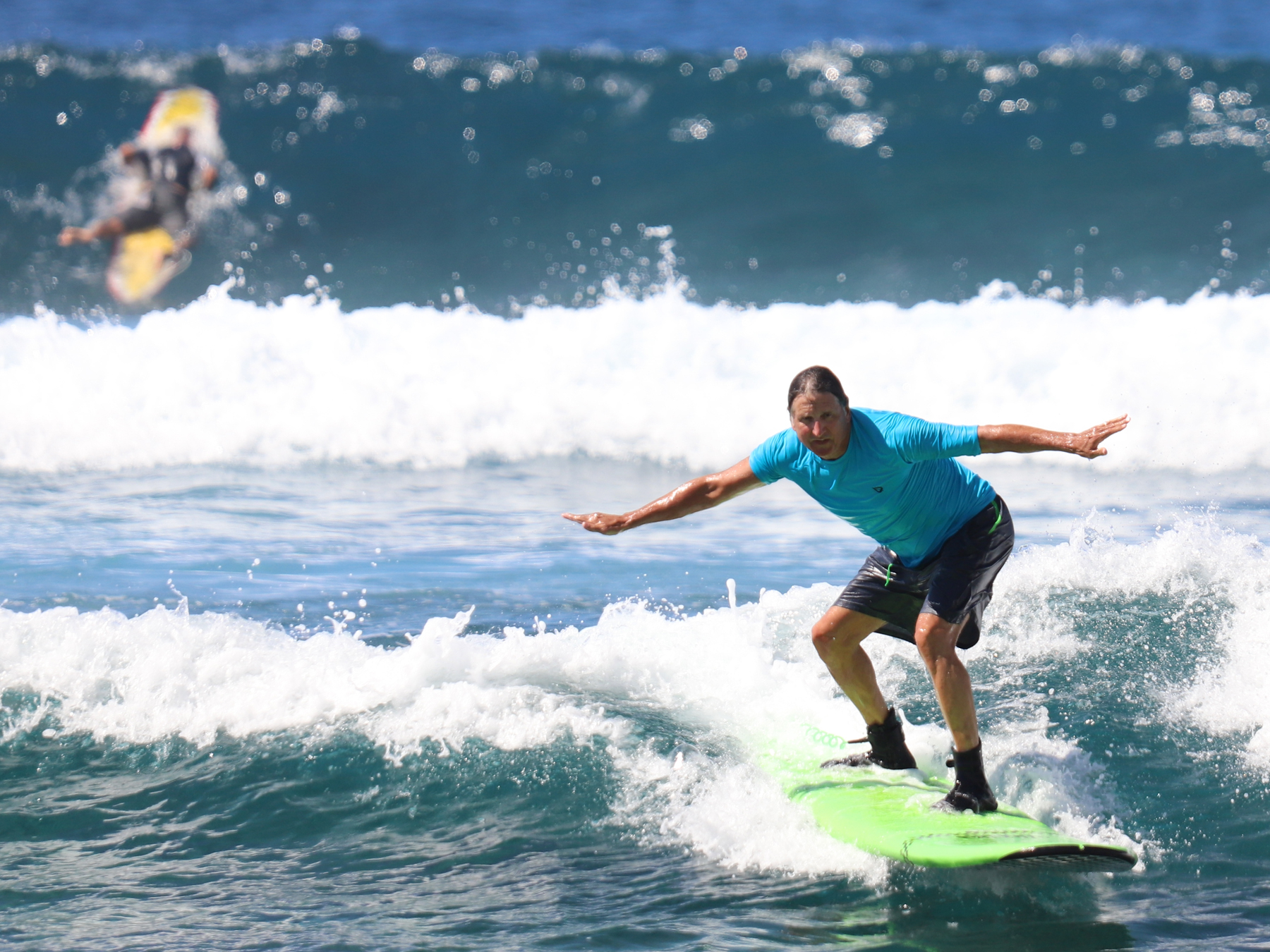 Surfer student at Kahaluu surf break
